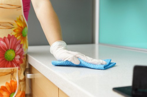 Professional office cleaners in Belsizepark maintaining a tidy workspace